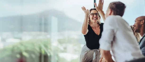 Colleagues celebrating in an office